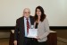 Dr. Nagib Callaos, General Chair, giving Prof. Renata Maria Abrantes Baracho the best paper award certificate of the session "Academic Activities and the Impact of Information and Communication Technologies on Societies." The title of the awarded paper is "BIM as a Structural Safety Study Tool in Case of Fire - BIMSCIP."